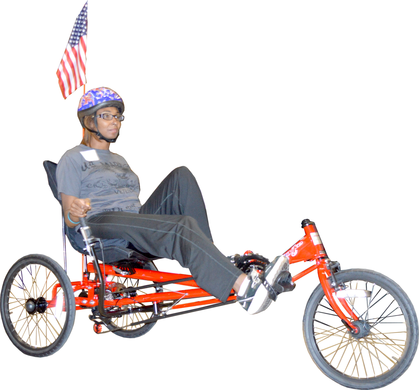 Adult with helmet riding recumbent road/trail tryke with hand breaks.
